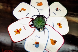 Set of 7 French embroidered baby bibs 